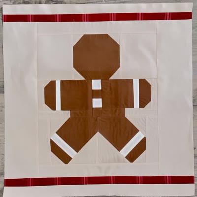 Gingerbread Pillow quilt block with red striped borders